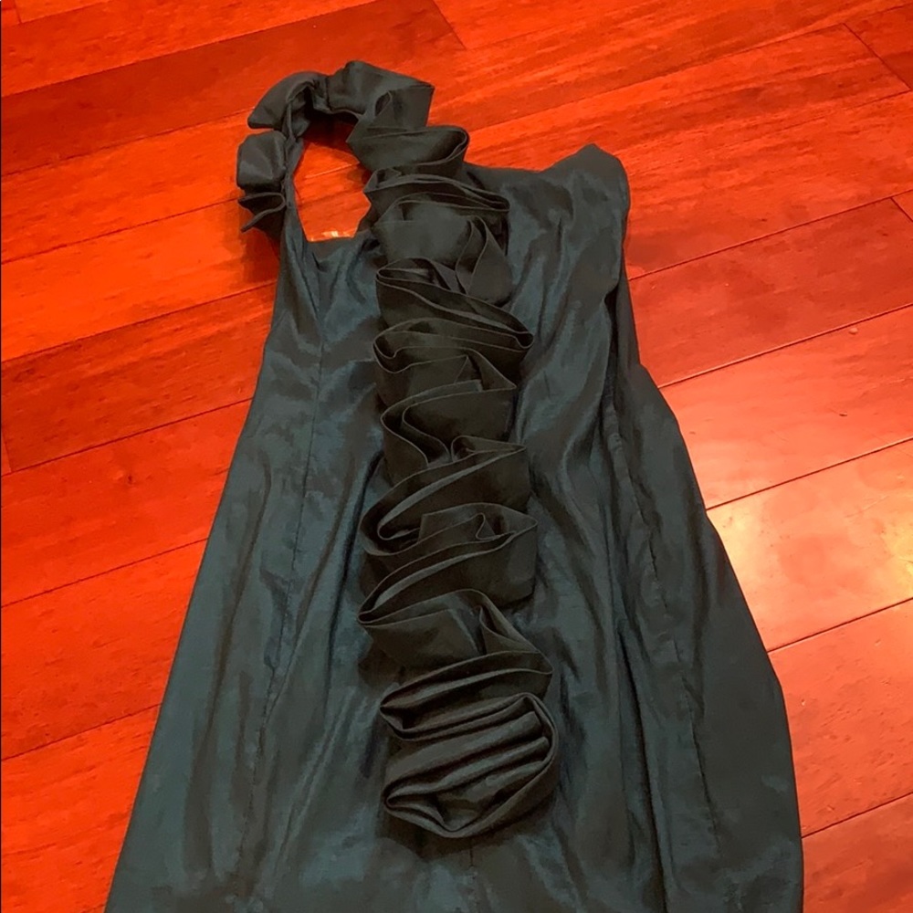 A unique one shoulder turquoise dress